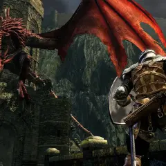 Rycerz w zbroi staje naprzeciw czerwonego smoka. To scena z gry Dark Souls, idealna do poradnika.