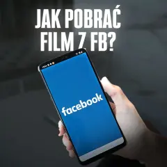 Dłoń trzyma smartfon z otwartą aplikacją Facebook. Napis "JAK POBLRAĆ FILM Z FB?" sugeruje poradnik.