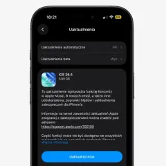 Ekran iPhone'a z informacją o aktualizacji iOS 26.4, która dodaje funkcję Koncerty w Apple Music i nowe emoji.