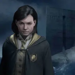 Młoda czarodziejka z Hogwart Legacy Hufflepuff stoi na tle burzliwego morza i tajemniczej budowli.