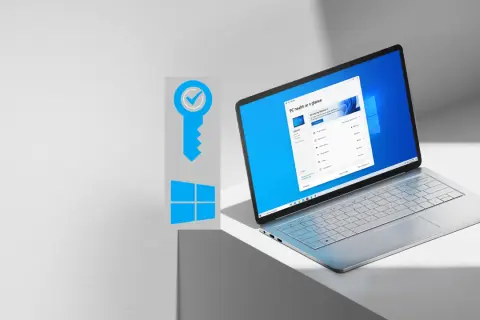 Grafika z kluczem i logo Windows, obok laptopa z ekranem pokazującym "PC health at a glance". Dowiedz się, jak sprawdzić klucz Windows 10.