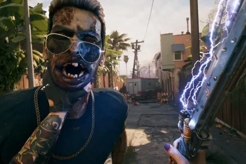 Zombi w okularach przeciwsłonecznych i z tatuażami, trzymający broń zasilaną elektrycznością. Czy to zapowiedź **Dead Island 2 crossplay**?