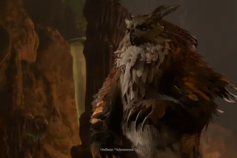 Potężny sowodźwiedź z Baldur's Gate 3, z piórami i pazurami, wydaje przerażający okrzyk w jaskini.