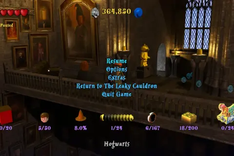 Menu gry Lego Harry Potter 1-4. Widok z Hogwartu, z opcjami "Wznów", "Opcje", "Dodatki", "Powrót do Dziurawego Kotła", "Wyjdź z gry".