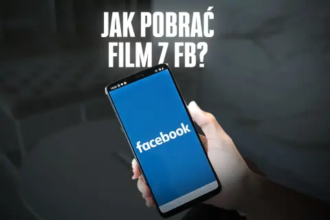 Dłoń trzyma smartfon z otwartą aplikacją Facebook. Napis "JAK POBLRAĆ FILM Z FB?" sugeruje poradnik.