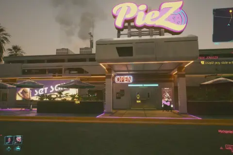 Cyberpunkowa pizzeria PieZ z neonowym znakiem. Zbliża się misja "Znak Jonasza", by usiąść przy stole.