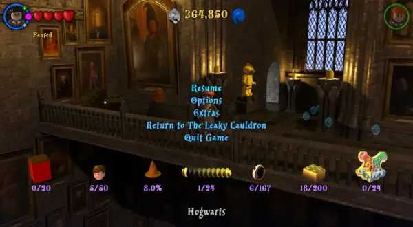 Menu gry Lego Harry Potter 1-4. Widok z Hogwartu, z opcjami "Wznów", "Opcje", "Dodatki", "Powrót do Dziurawego Kotła", "Wyjdź z gry".