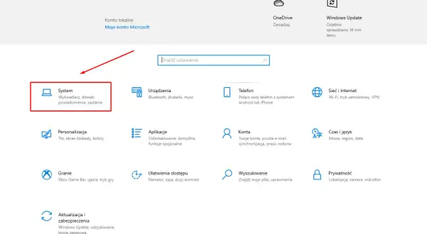 Ekran ustawień Windows z zaznaczoną opcją "System" i ikoną komputera.