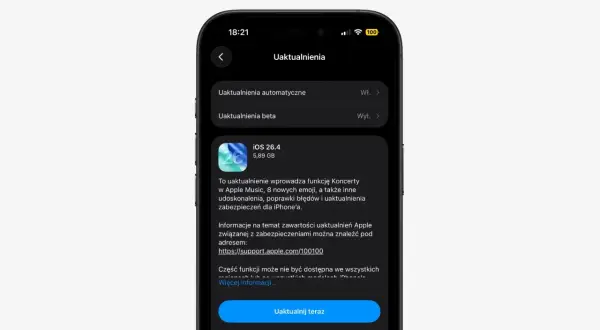 Ekran iPhone'a z informacją o aktualizacji iOS 26.4, która dodaje funkcję Koncerty w Apple Music i nowe emoji.