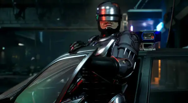 RoboCop w swoim ikonicznym pancerzu opiera się o radiowóz, gotowy do akcji w grze RoboCop: Rogue City.