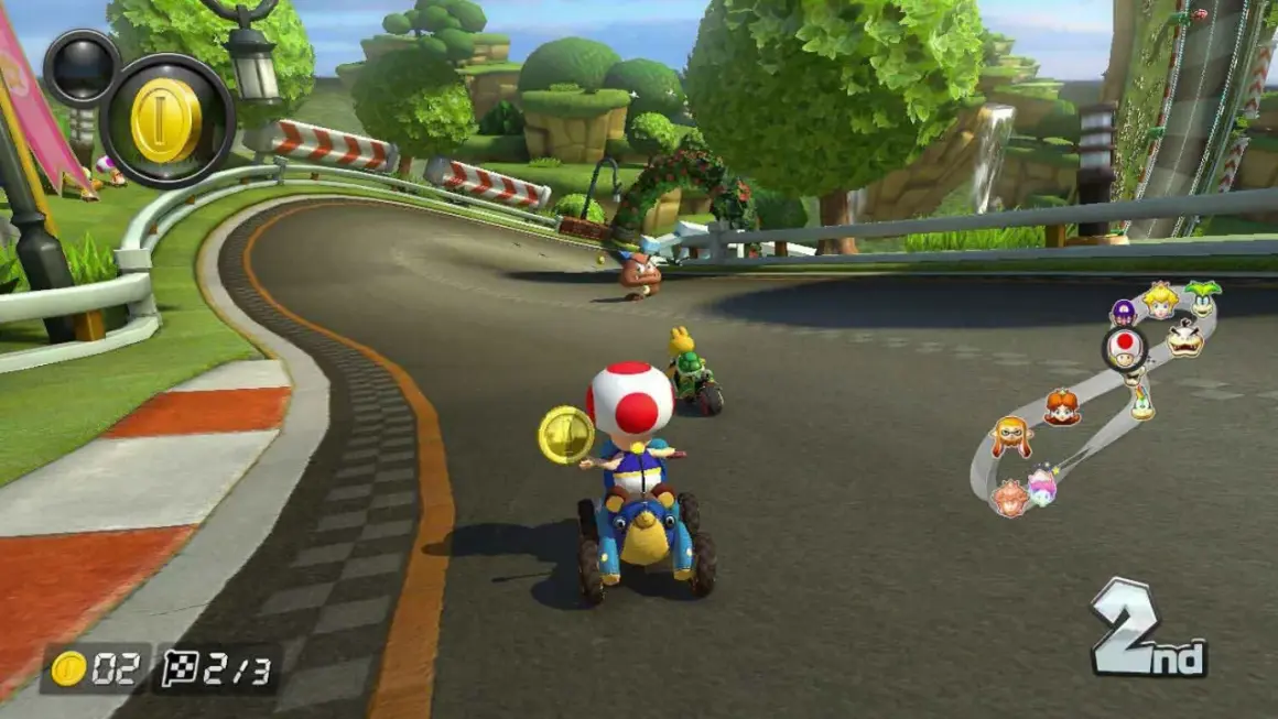 Wyścig w Mario Kart na PS5: Toad na drugim miejscu zbiera monety, a za nim jedzie Yoshi.