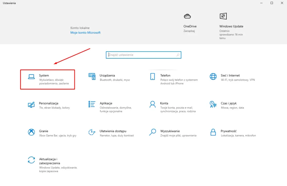 Ekran ustawień Windows z zaznaczoną opcją "System" i ikoną komputera.