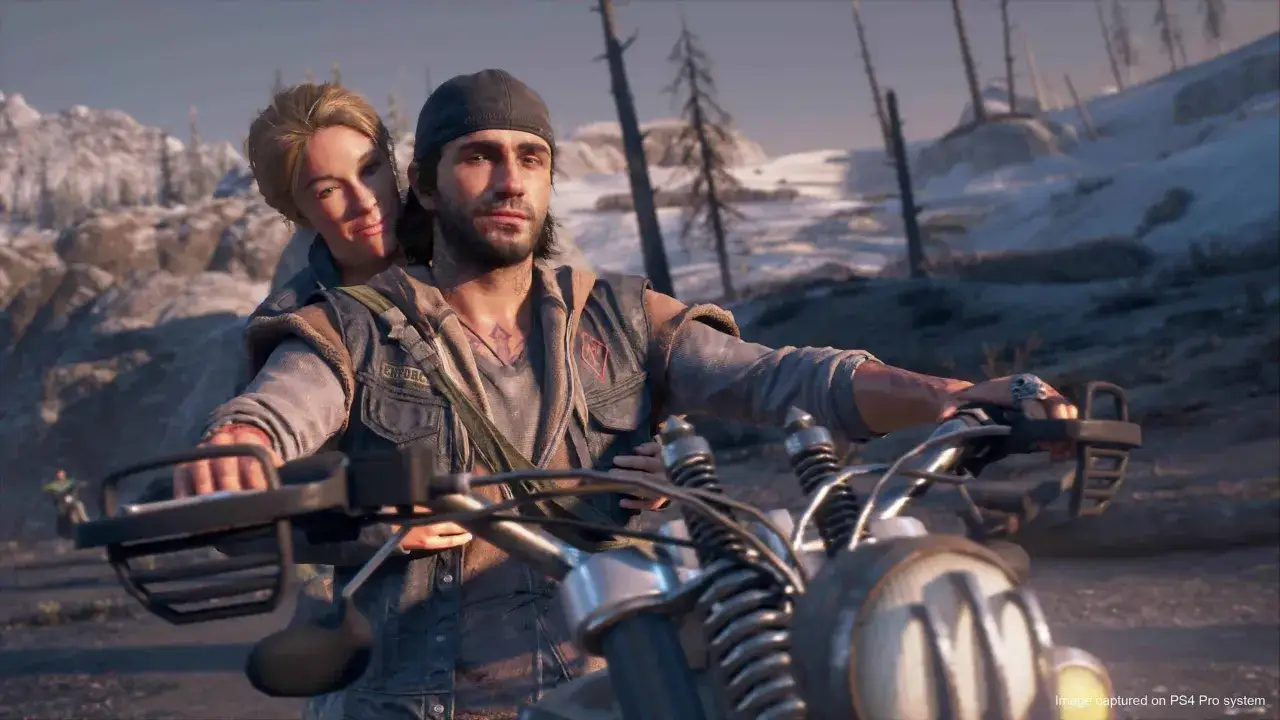 Para z Days Gone na motocyklu, w tle zimowy krajobraz. Sprawdź wymagania Days Gone, by cieszyć się tą przygodą.