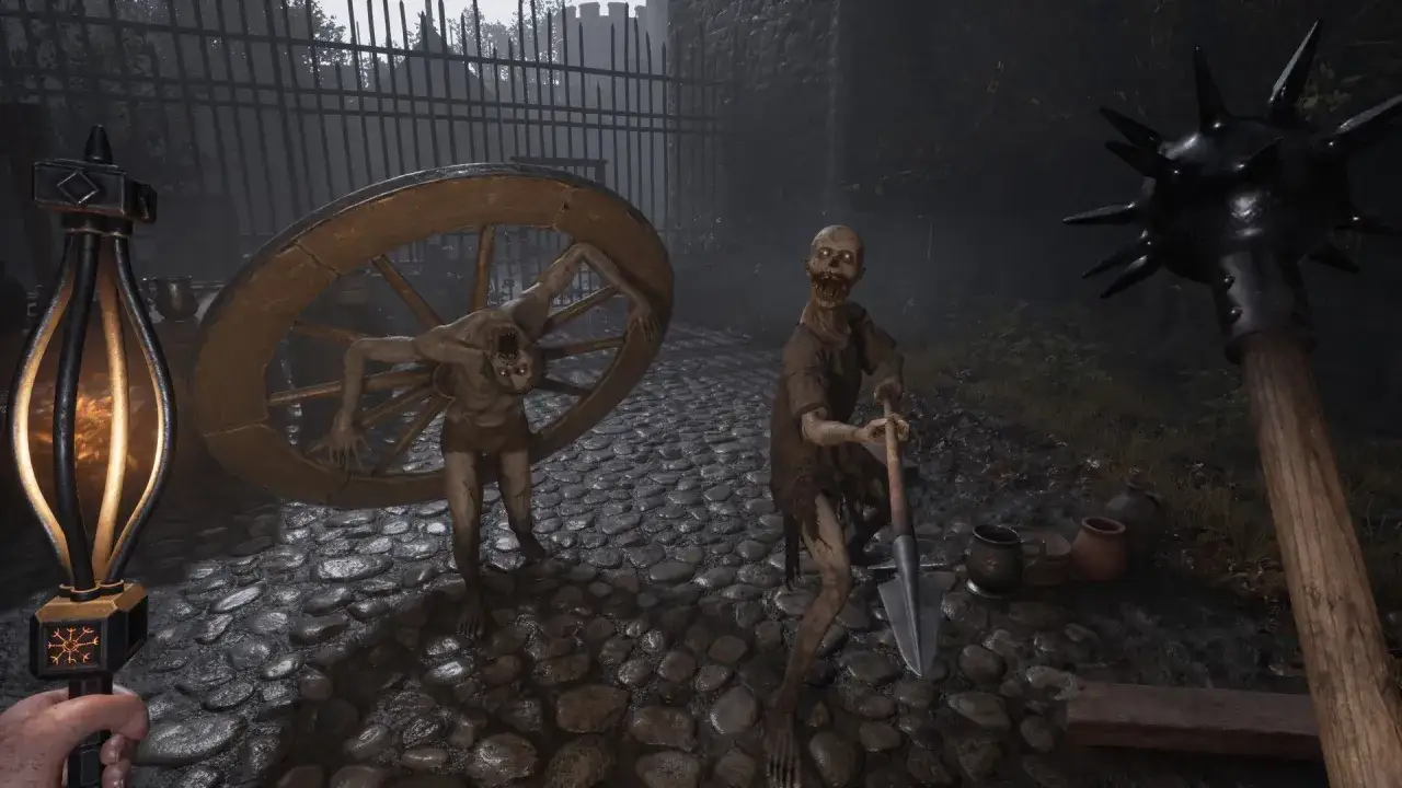 Dwa potwory, jeden z kołem, drugi z łopatą, stoją na bruku. W ręku gracza pochodnia i cep. Valor mortis.
