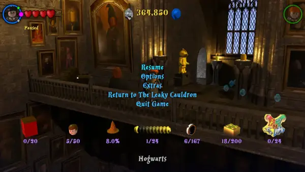 Menu gry Lego Harry Potter 1-4. Widok z Hogwartu, z opcjami "Wznów", "Opcje", "Dodatki", "Powrót do Dziurawego Kotła", "Wyjdź z gry".