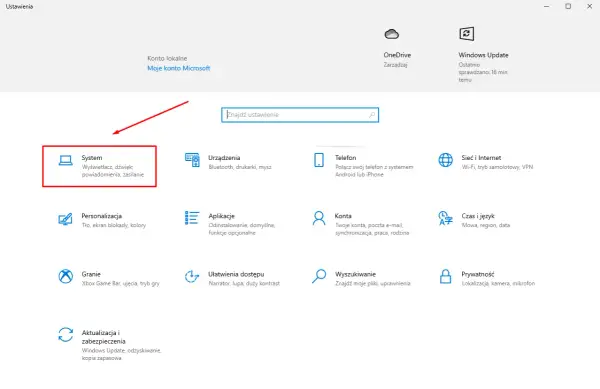 Ekran ustawień Windows z zaznaczoną opcją "System" i ikoną komputera.
